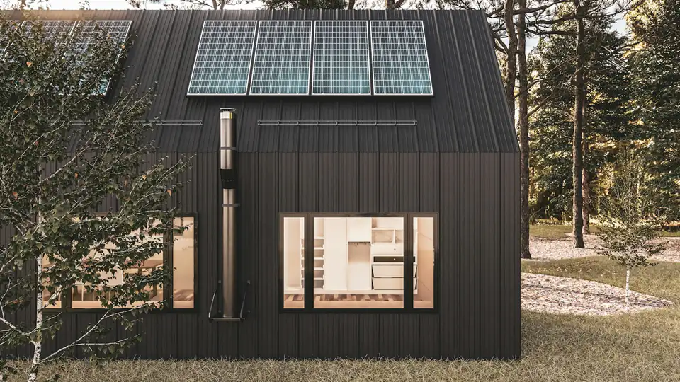 Black-clad garden building with roof solar panels, design inspiration for garden rooms in Newcastle Black-clad garden building with roof solar panels, an eco garden room idea for the North East