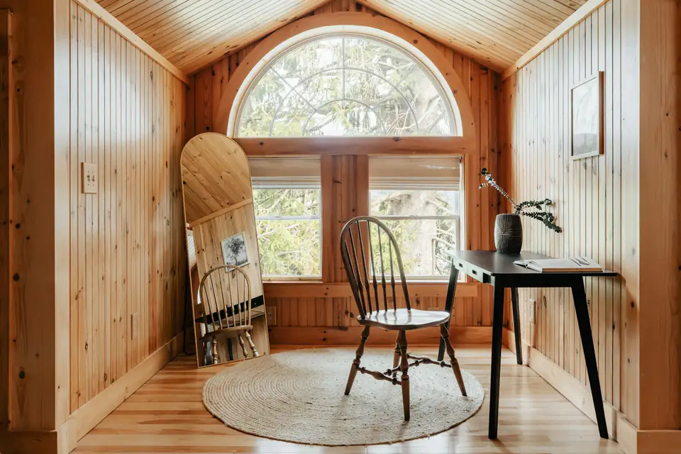 Timber-lined garden office with desk, design inspiration for garden rooms in Newcastle Timber-lined garden office with a desk beneath a large window, inspiration for Newcastle